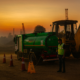 FuelBuddy diesel delivery truck refueling excavator at remote construction site during sunrise.