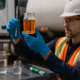 Technician testing diesel quality using water-detecting paste and hydrometer during on-site inspection